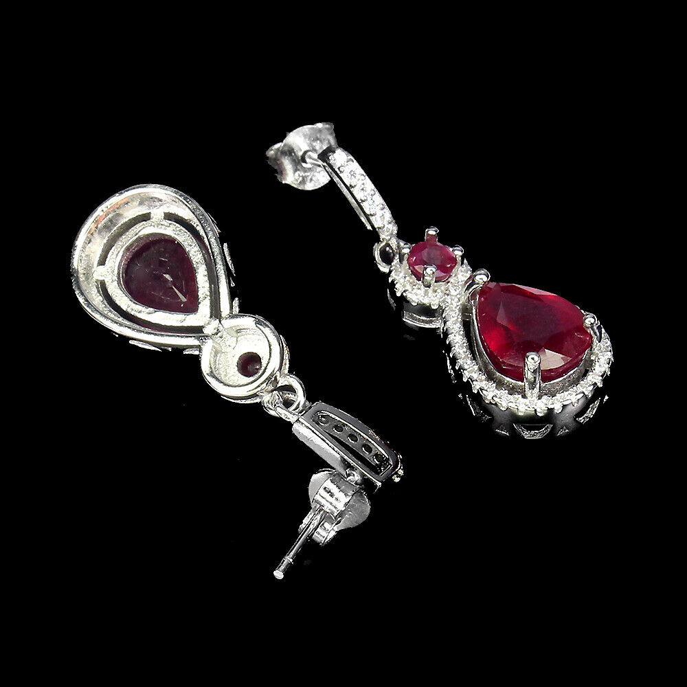 A pair of 925 silver drop earrings set with pear and round cut rubies and white stones, L. 2.9cm. - Image 2 of 2