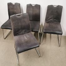 A set of four chrome and snakeskin texture leather dining chairs.