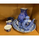 A group of blue and white porcelain items.