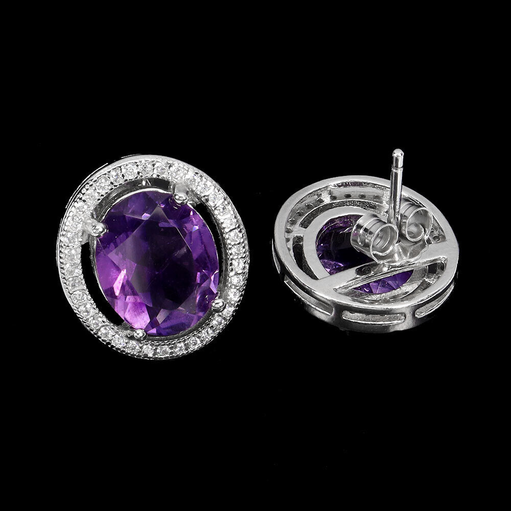 A pair of 925 silver earrings set with oval cut amethysts and white stones, L. 1.6cm. - Image 2 of 2