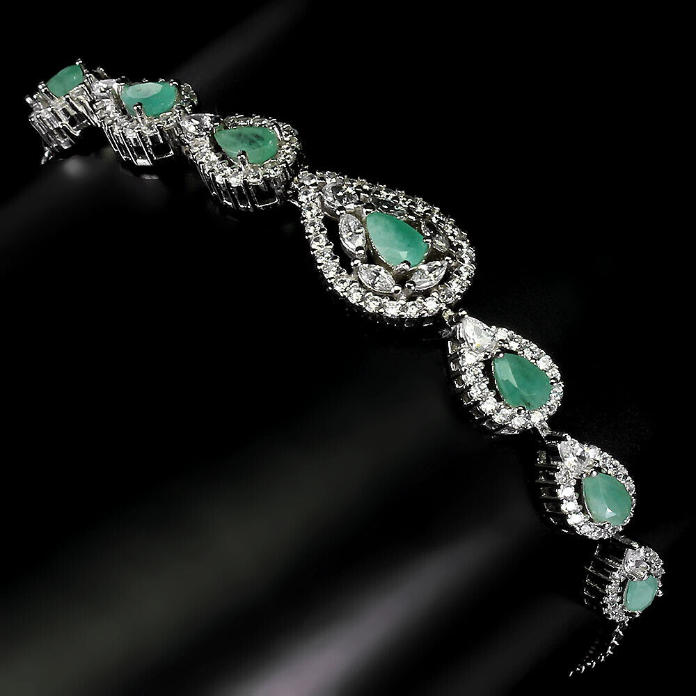 A 925 silver bracelet set with pear cut emeralds and white stones, L. 17cm. - Image 2 of 3