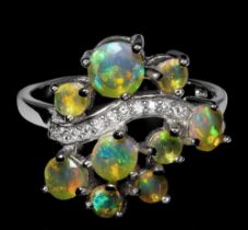 A matching 925 silver ring set with opals and white stones, ring size P.5.