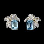 A pair of 925 silver earrings set with emerald cut blue topaz and white stones, L. 1.4cm.