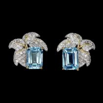 A pair of 925 silver earrings set with emerald cut blue topaz and white stones, L. 1.4cm.