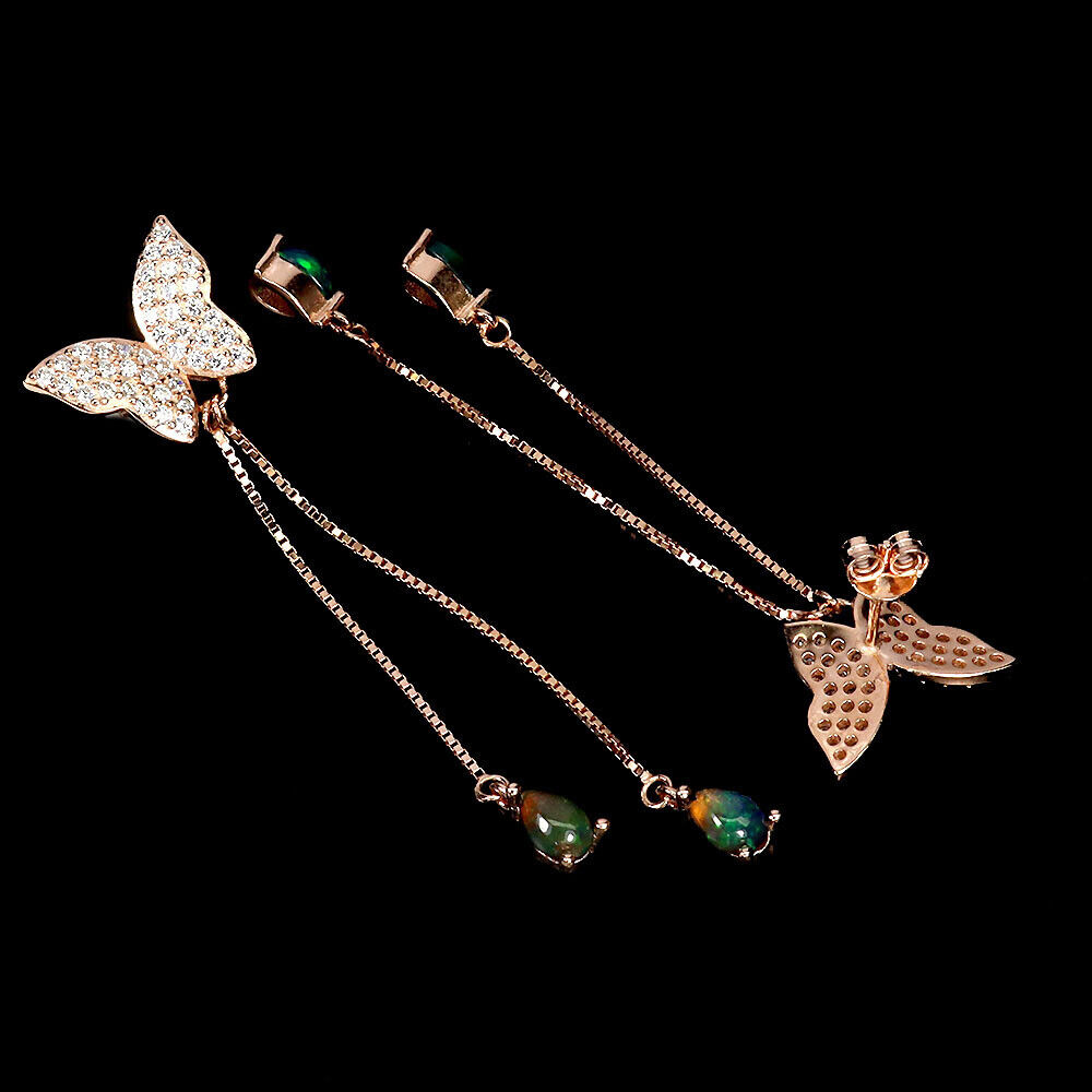 A pair of rose gold on 925 silver butterfly shaped drop earrings set with opals, L. 6cm. - Image 2 of 2