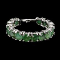 A 925 silver full eternity ring set with round cut emeralds, ring size Q.