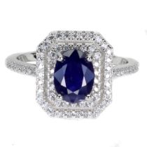 A 925 silver ring set with oval cut sapphire and white stones, ring size N.5.