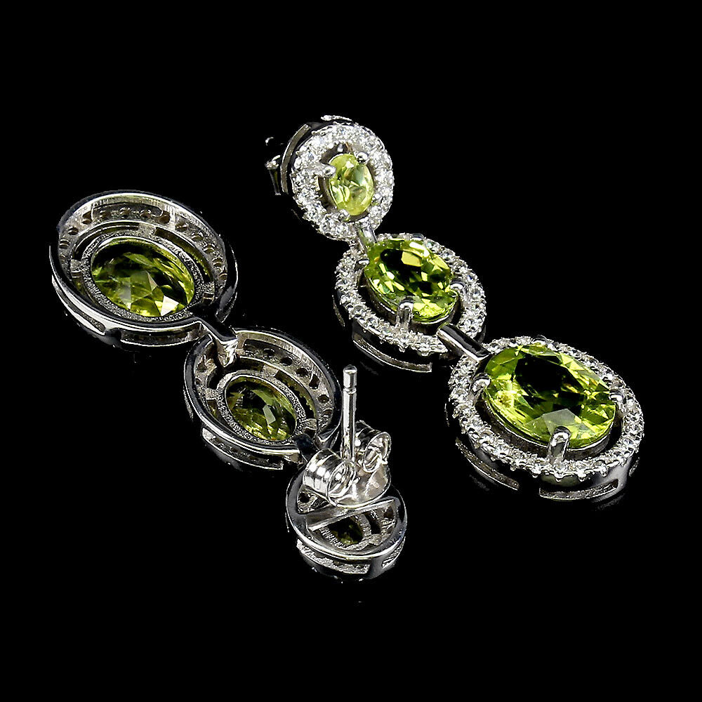 A pair of 925 silver drop earrings set with oval cut graduated peridots and white stones, L. 3. - Image 2 of 2