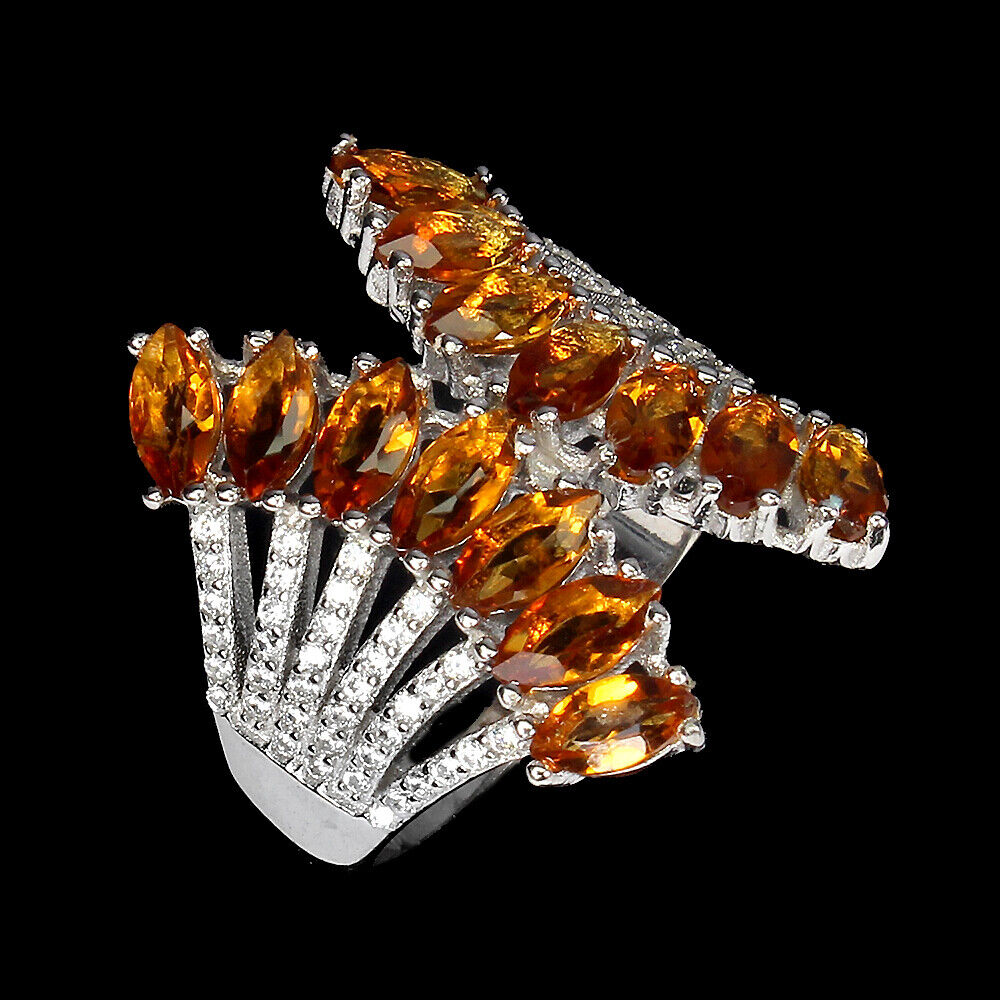 A 925 silver ring set with marquise cut citrines and white stones, ring size N.