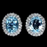 A pair of 925 silver earrings set with oval cut Swiss blue topaz and white stones, L. 1.4cm.