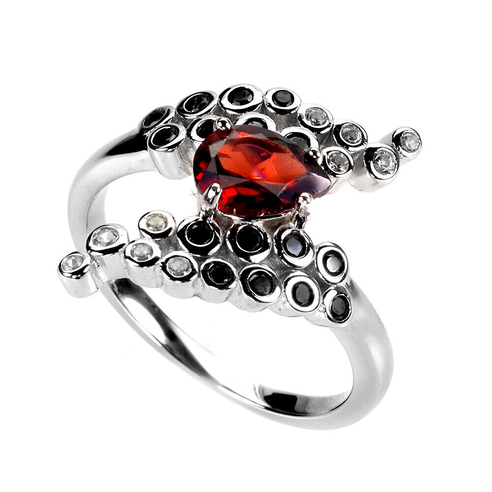 A 925 silver ring set with a pear cut garnet, onyx and white stones, ring size M.5. - Image 2 of 3