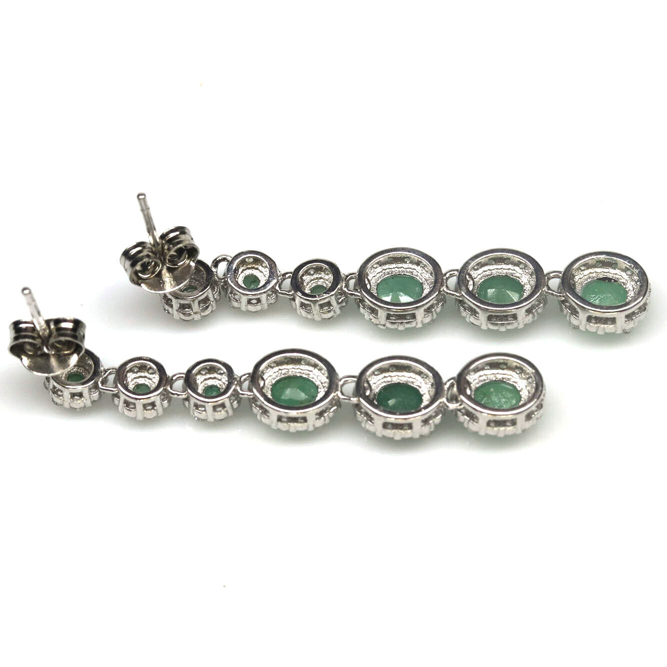 A pair of 925 silver drop earrings set with oval cut emeralds and white stones, L. 3.8cm. - Image 2 of 2