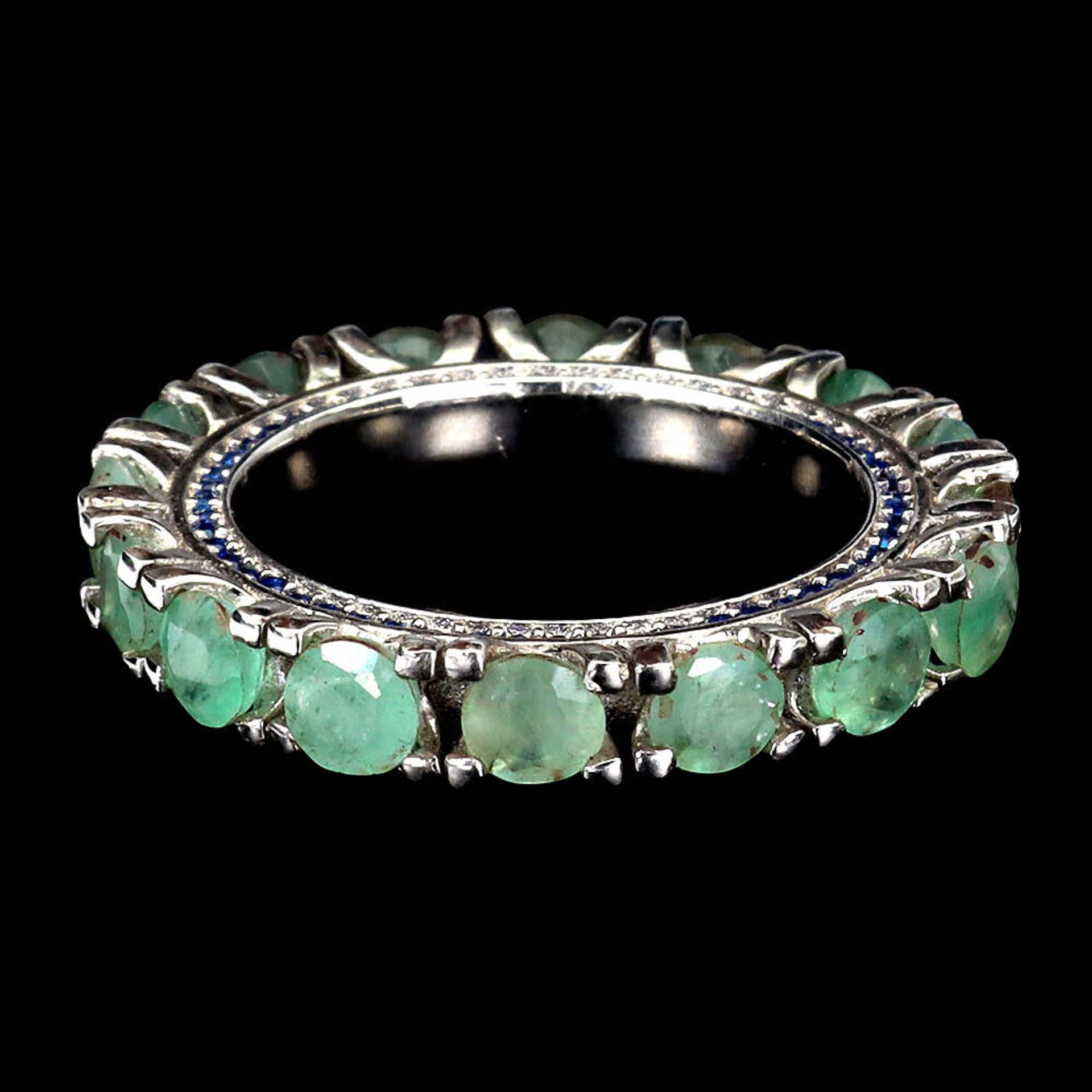 A 925 silver full eternity ring set with emeralds and sapphire set shank, ring size O. - Image 3 of 3