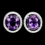 A pair of 925 silver earrings set with oval cut amethysts and white stones, L. 1.6cm.