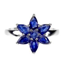 A 925 silver cluster ring set with pear and round cut sapphires, ring size N.5.