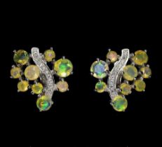 A pair of 925 silver opal and white stones set earrings, L. 1.7cm.