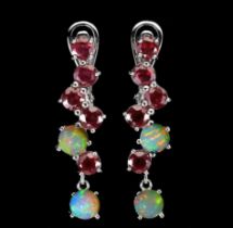 A matching pair of 925 silver drop earrings set with rubies and opals, L. 3cm.