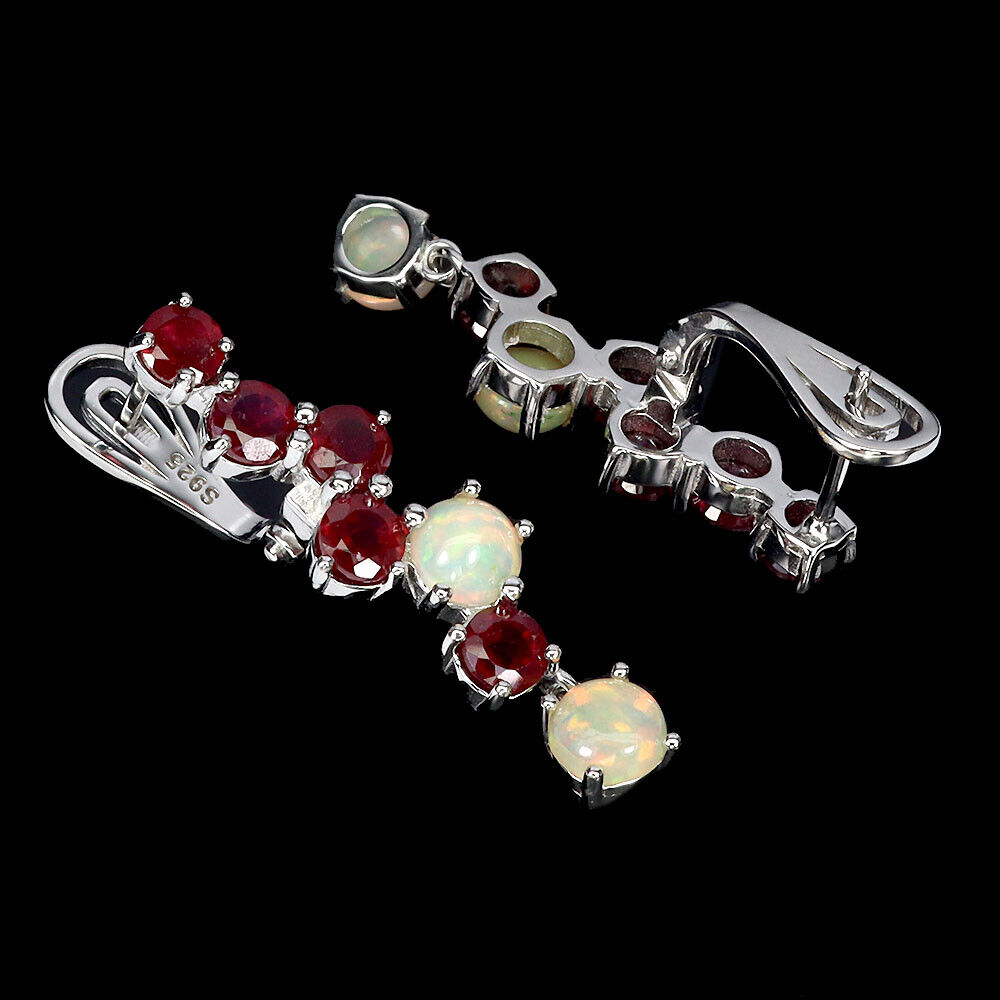 A matching pair of 925 silver drop earrings set with rubies and opals, L. 3cm. - Image 2 of 2