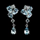 A pair of 925 silver drop earrings set with oval and round cut Swiss blue topaz, L. 3.6cm.