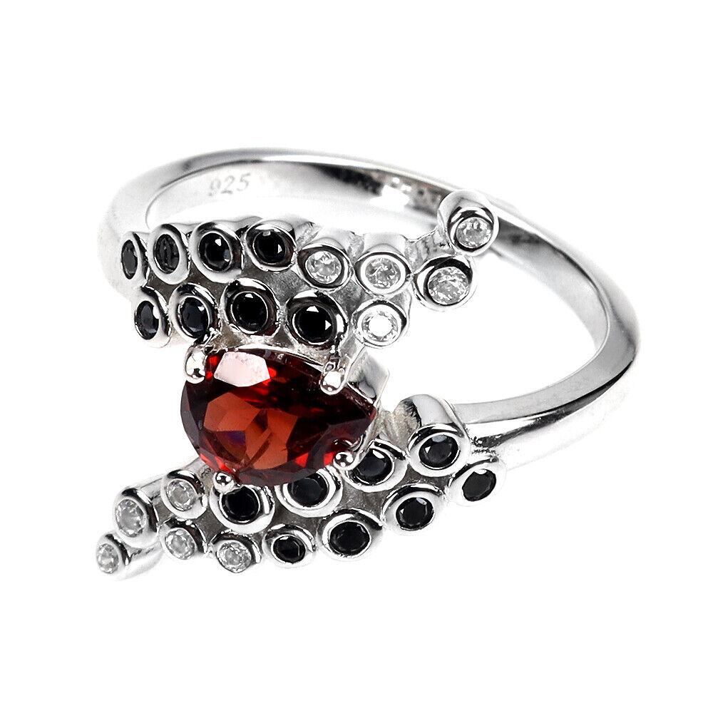 A 925 silver ring set with a pear cut garnet, onyx and white stones, ring size M.5. - Image 3 of 3