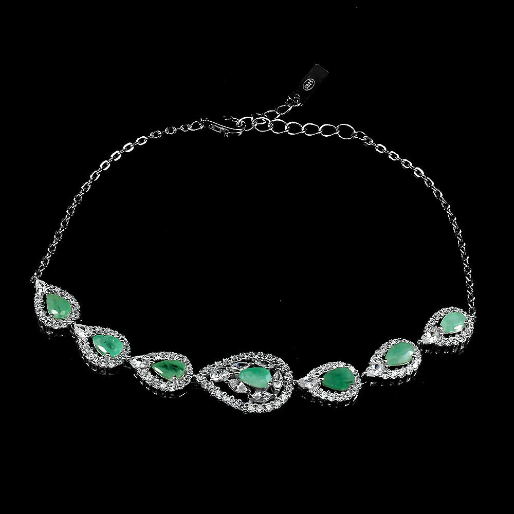 A 925 silver bracelet set with pear cut emeralds and white stones, L. 17cm.