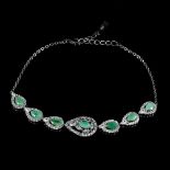 A 925 silver bracelet set with pear cut emeralds and white stones, L. 17cm.