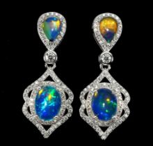 A pair of 925 silver drop earrings set with cabochon cut opal and white stones, L. 3.3cm.