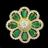 A gold on 925 silver flower shaped ring set with oval cut emeralds and white stones, Dia. 2cm,