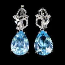 A pair of 925 silver drop earrings set with pear cut blue topaz and white stones, L. 3.1cm.