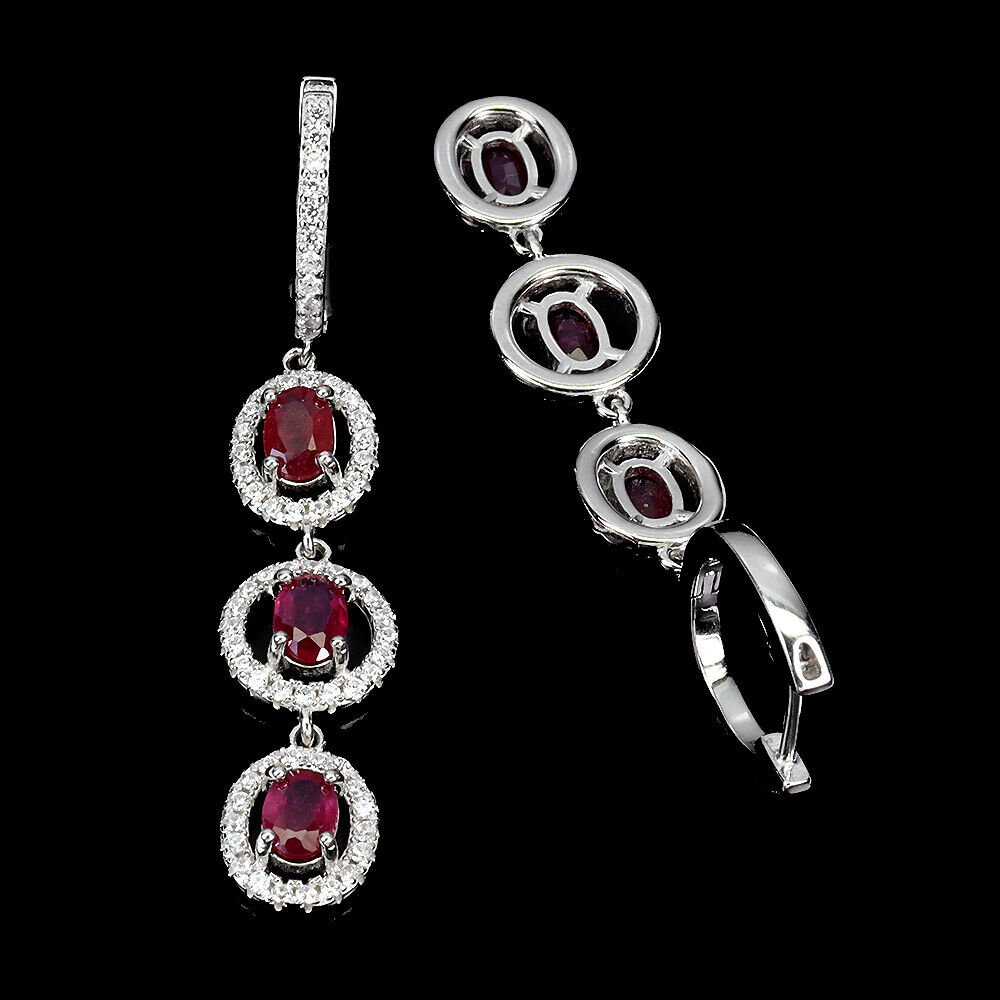 A pair of 925 silver drop earrings set with oval cut rubies and white stones, L. 5.2cm. - Image 2 of 2