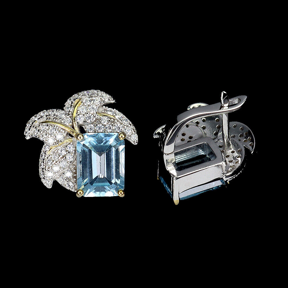 A pair of 925 silver earrings set with emerald cut blue topaz and white stones, L. 1.4cm. - Image 2 of 2