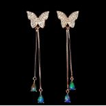 A pair of rose gold on 925 silver butterfly shaped drop earrings set with opals, L. 6cm.