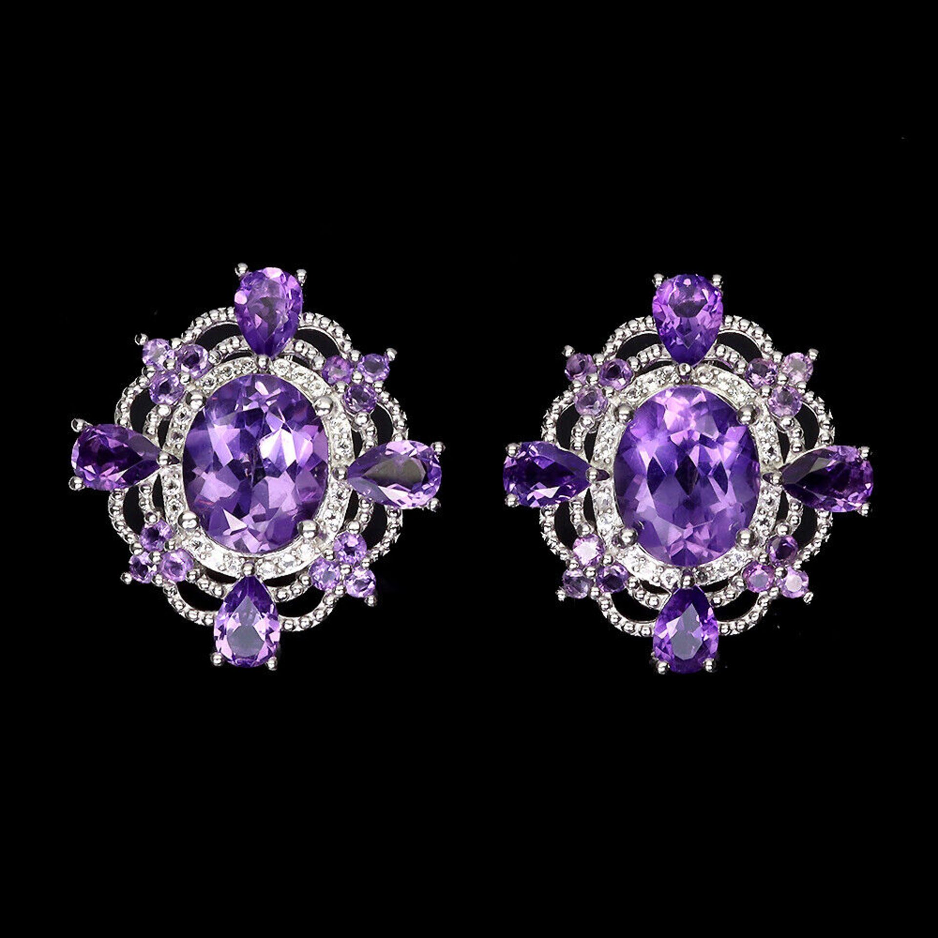 A pair of 925 silver earrings set with oval cut amethysts and white stones, L. 2.4cm.