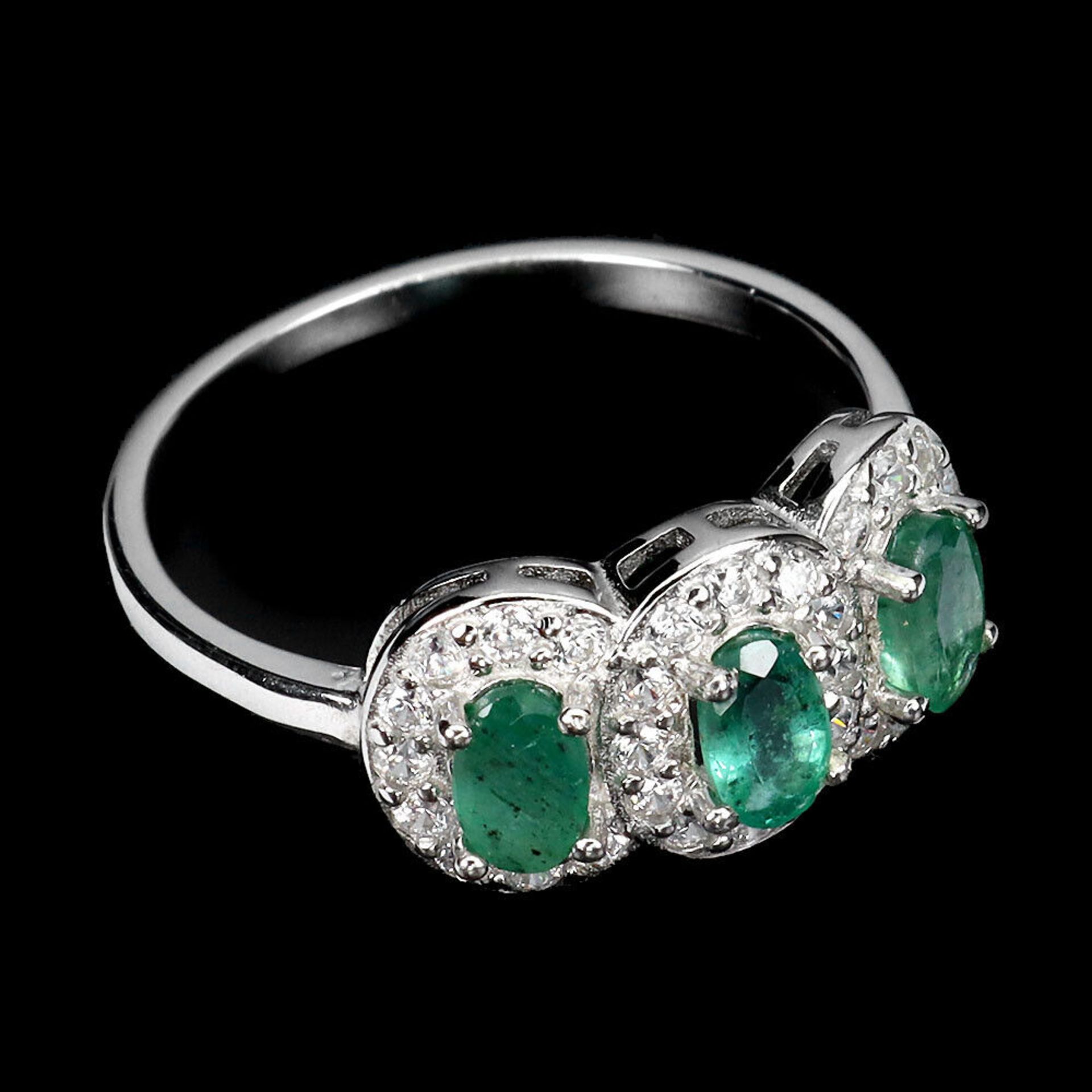 A 925 silver triple cluster ring set with oval cut emeralds and white stones, ring size N.5. - Image 3 of 3
