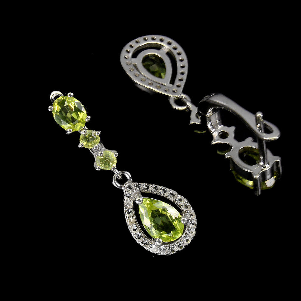 A pair of 925 silver drop earrings set with pear and oval cut peridot and white stones, L. 3cm. - Image 2 of 2