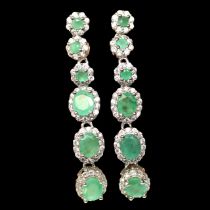 A pair of 925 silver drop earrings set with oval cut emeralds and white stones, L. 3.8cm.