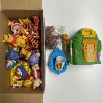 Various Winnie the Pooh Disney figures.