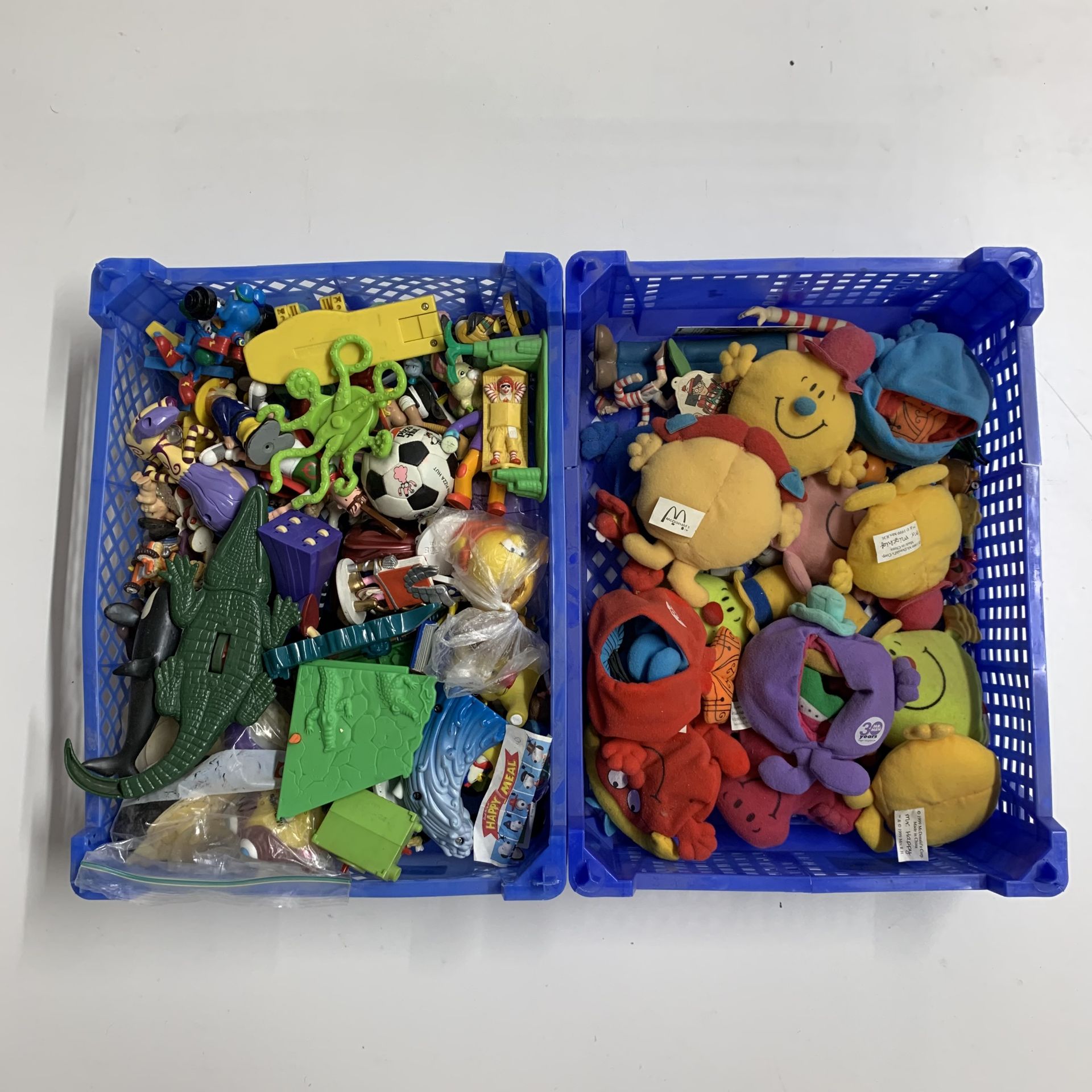 4 mixed trays of various happy meal toys and others etc.