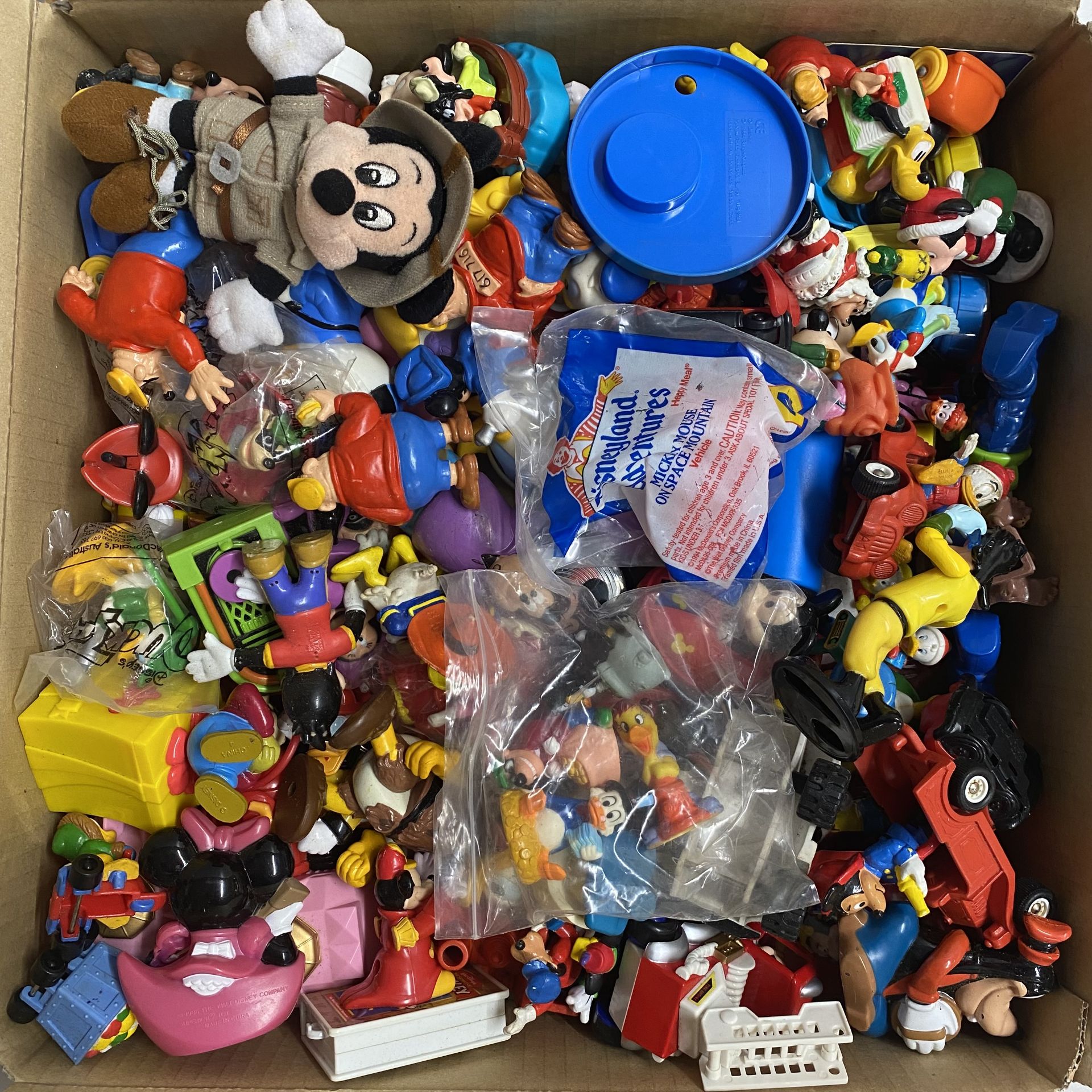 An assortment of Disney Micky Mouse figures.