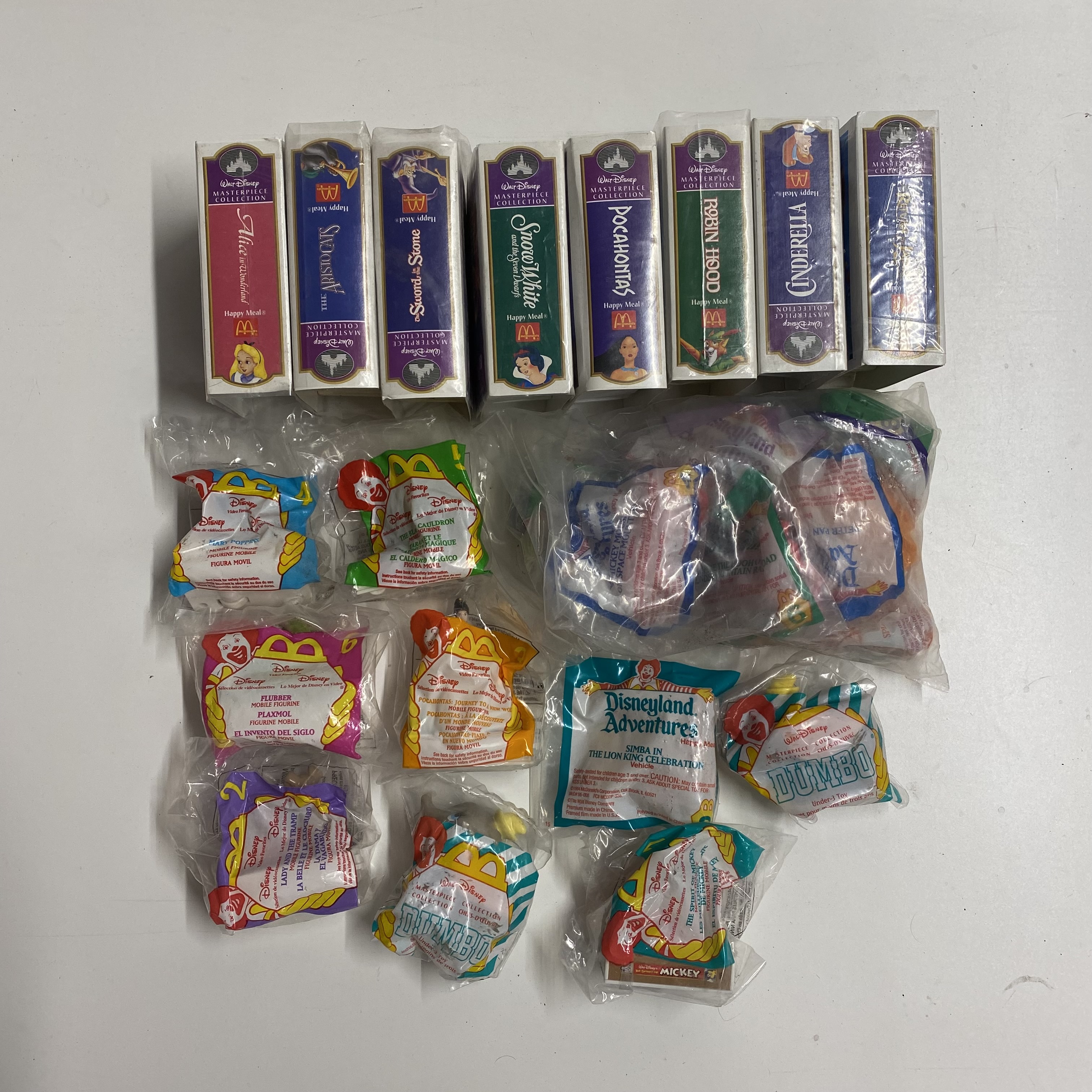 A quantity of mixed Mcdonald Disney toys including American video case set (sealed).