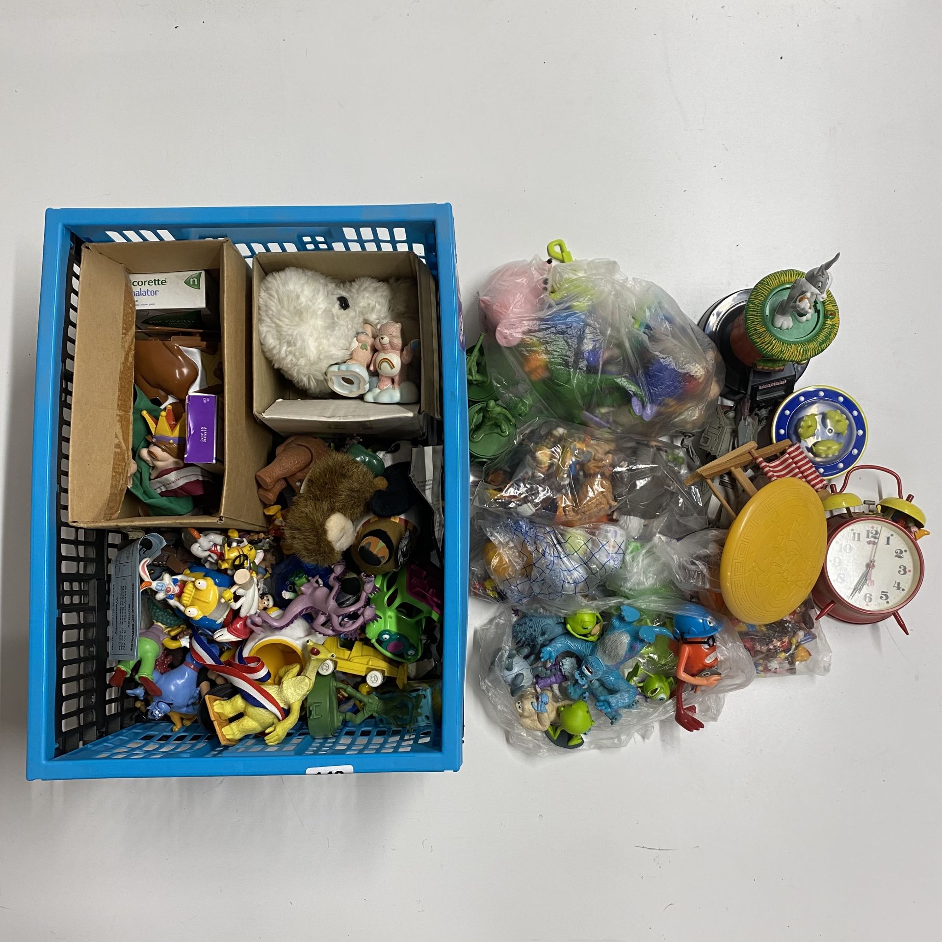 A large mixed box of various toys.