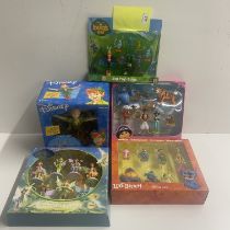 Five unopened boxes of various Disney film characters.