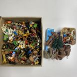 A large collection of playmobil toys.