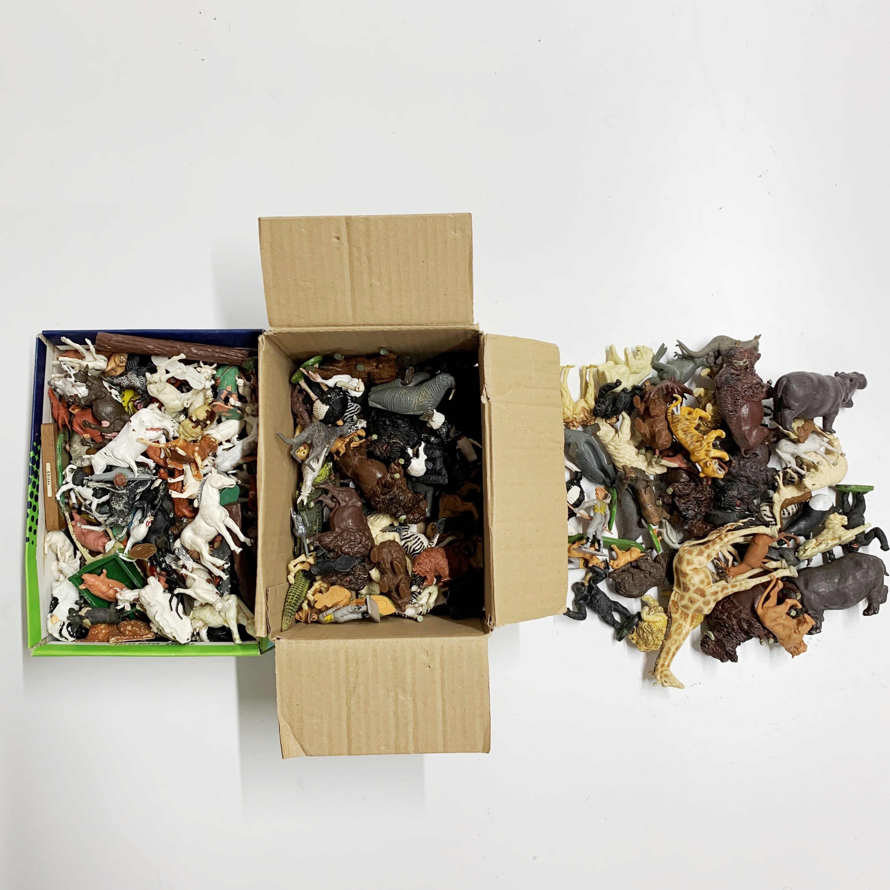 Two boxes of various animals including Britains.