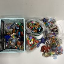 A box of mixed Disney toys including McDonalds happy meal and others.