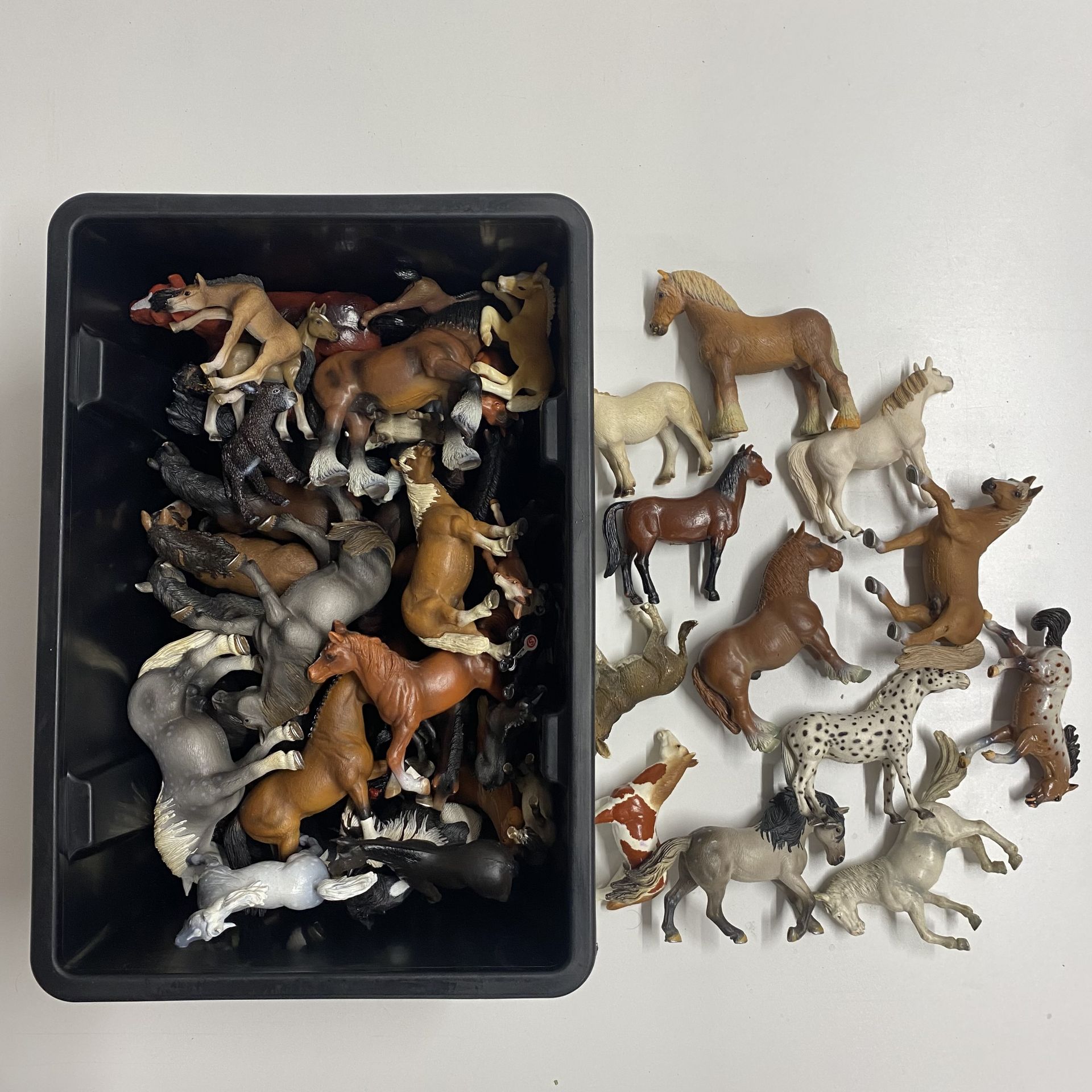 A quantity of Schleich and other horses.