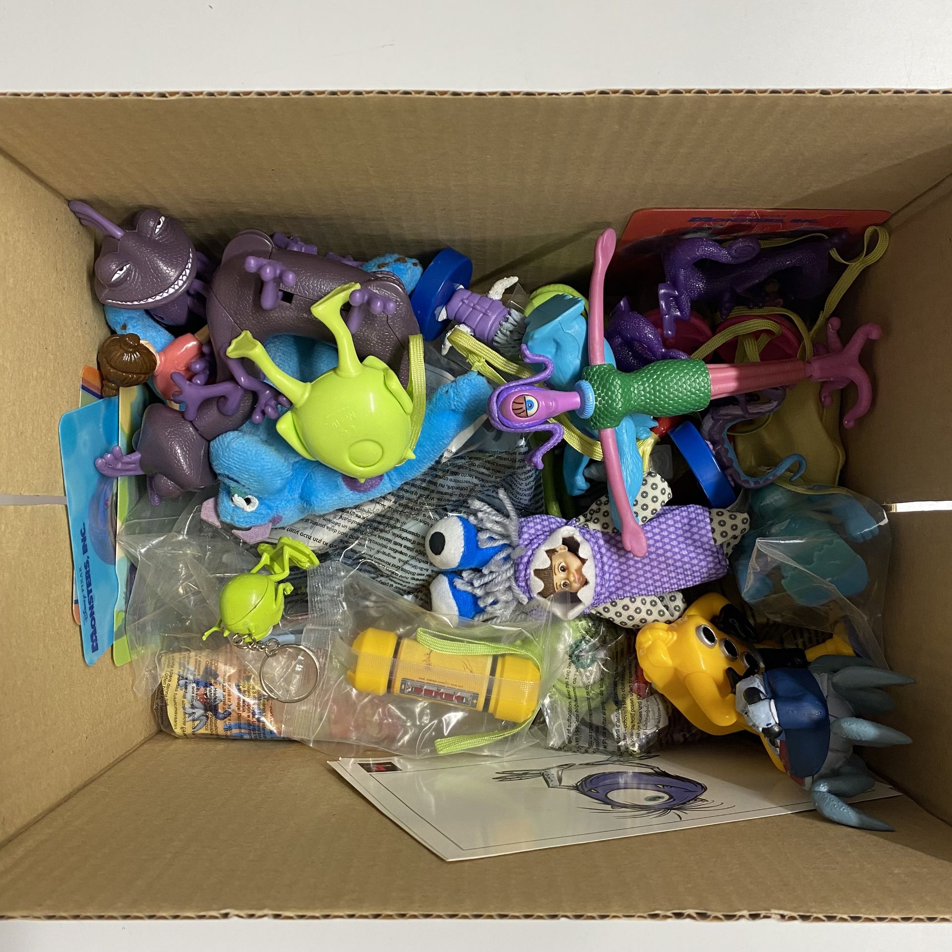 A box containing Disney's Monster INC toys. - Image 2 of 2