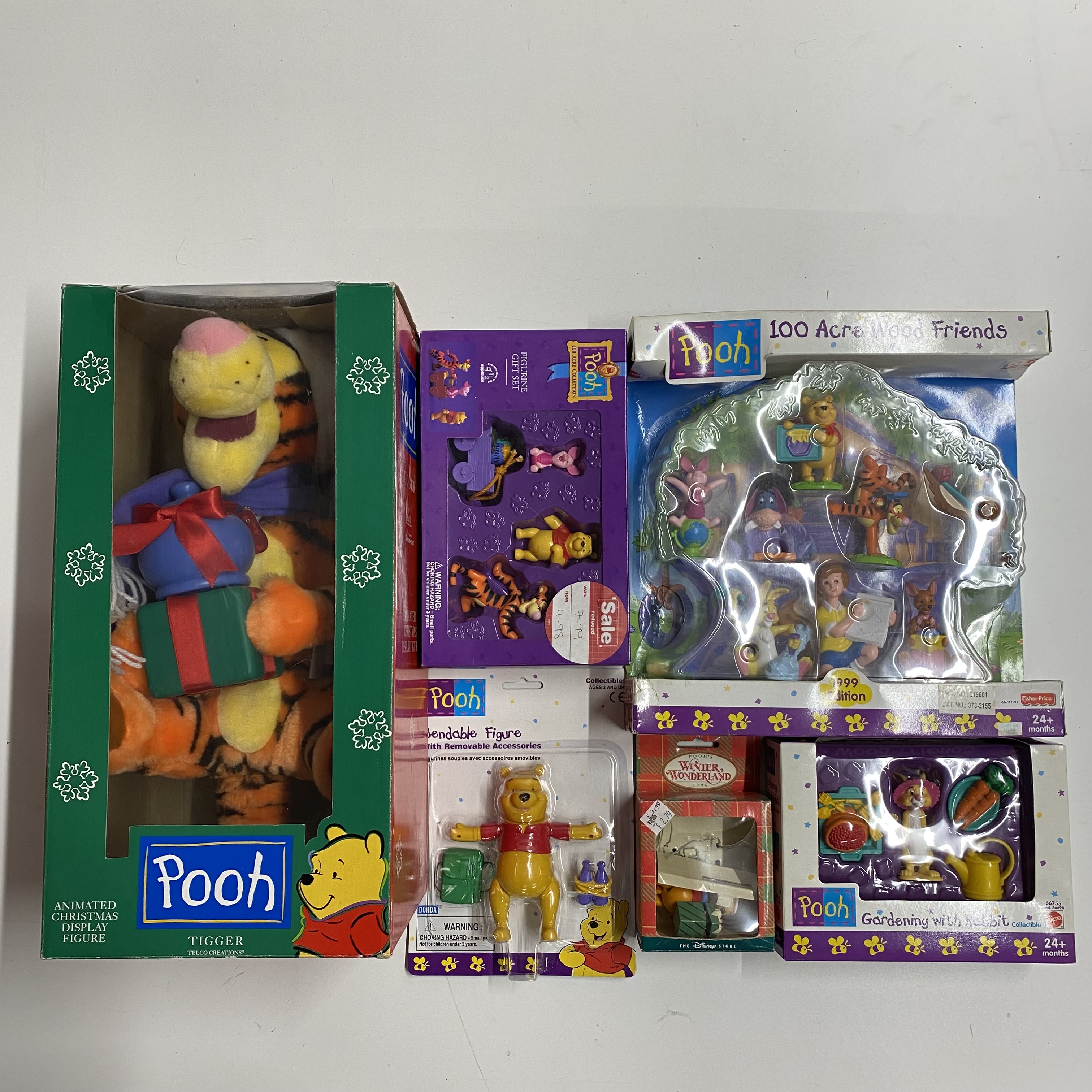A large quantity of various Winnie the Pooh and friends characters of which some are