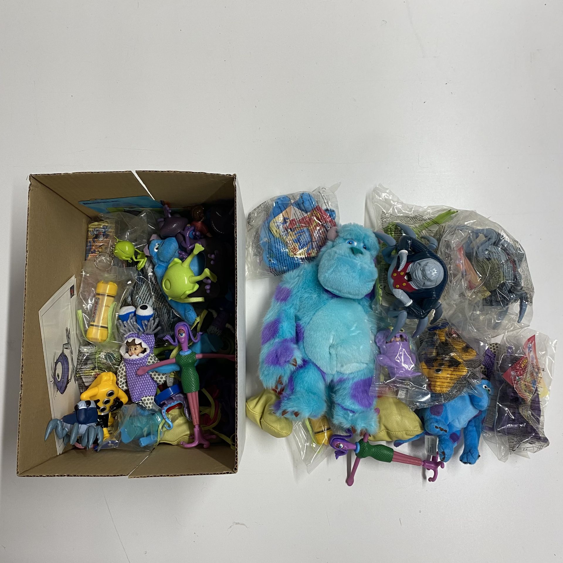 A box containing Disney's Monster INC toys.