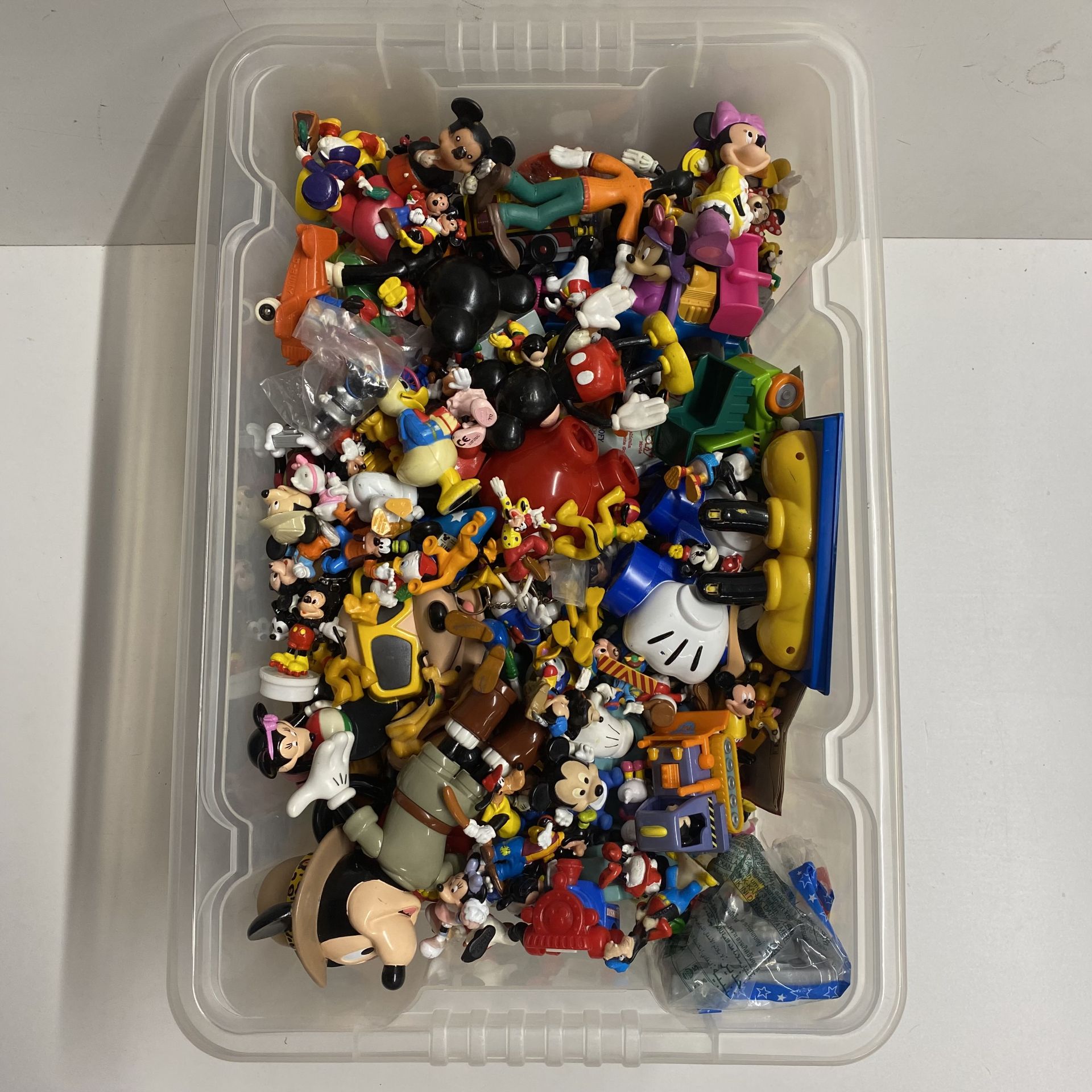 An extensive collection of various Disney characters including Mickey Mouse , Mini M